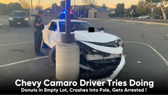 Chevy Camaro Driver Tries Doing Donuts in Empty Lot, Crashes Into Pole, Gets Arrested