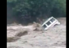 Mahindra Bolero Gets Swept Away In Canal Under Heavy Rainfall [Video]